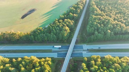 View From Above of Busy American Highway with Fast Moving Trucks and Cars Interstate Transportation