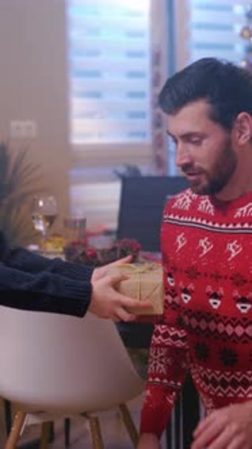Father and Daughter Exchanging Christmas Gift