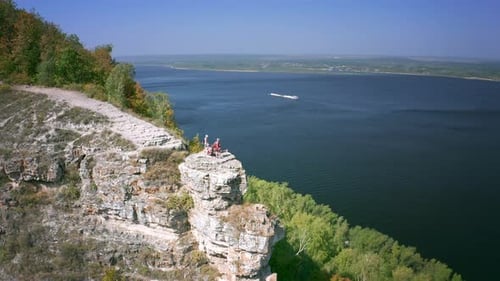 Hikers on the rock. Group of hikers stand on top of the rock ( Camel Rock) and enjoy the view. Zhigu