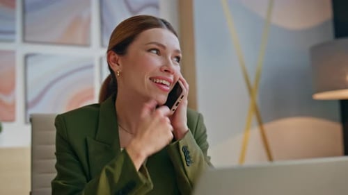 Smiling Executive Speaking Mobile Phone in Modern Office Closeup Woman Laughing