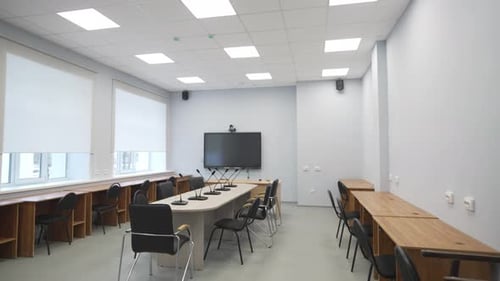 Empty Boardroom with Microphones and Television