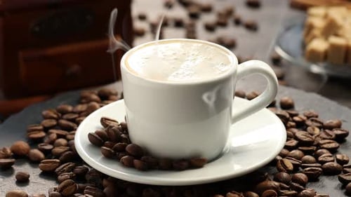 Steaming Coffee and Coffee Beans Close-up
