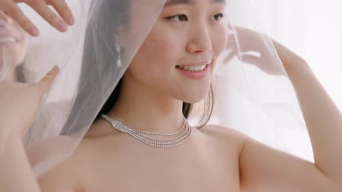 Bride Getting Ready for Wedding with Friend