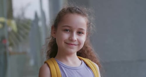 Portrait Beautiful of a Happy School Girl a Smiling School Girl a Little Girl with a Backpack