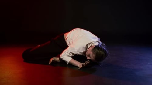 Dancer Performs Contemporary Dance on Stage