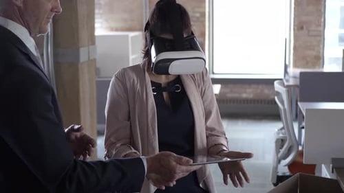 Business team innovating with vr simulator and digital tablet in modern office