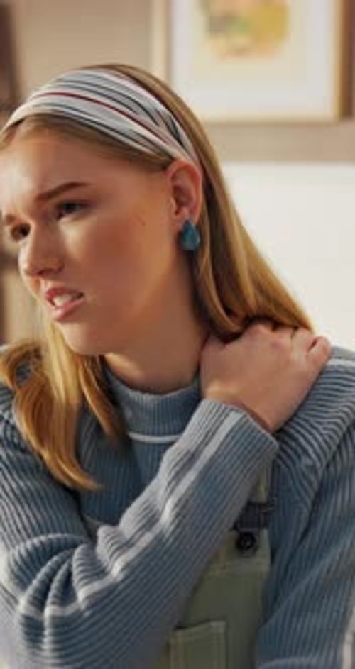 Young Woman Massaging Shoulder Due To Pain