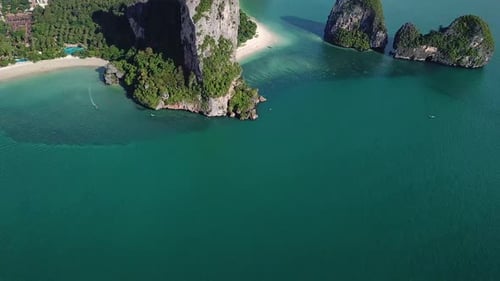 Tilt Up Aerial View on Breathtaking Nature of Thailand Coast. Limestone Cliffs on Railay White Sand