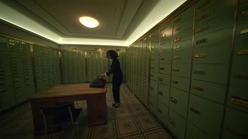 Woman Opens Safe Deposit Box in Vault