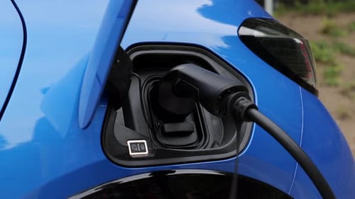 Close Up of Electric Vehicle Charging at a Modern Power Station