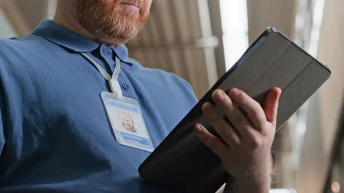 Black Tablet in Male Hands