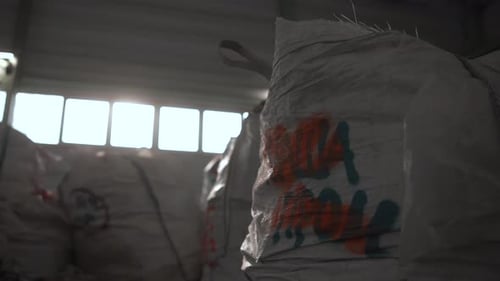 Industrial Scene With Stacked Large Bags Storage Area Featuring Branded Bulk Containers On Pallets
