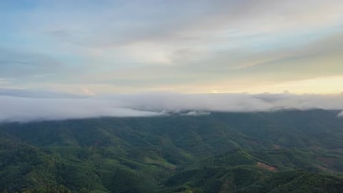 Time lapse video aerial view morning scenery Mist flowing over the high mountains.