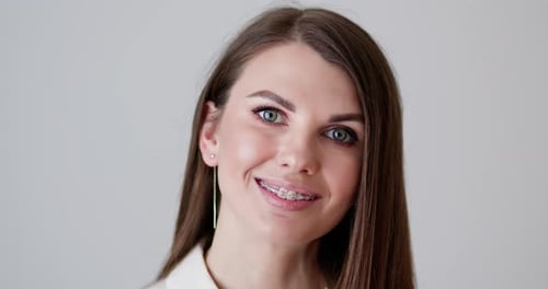 Smiling Woman with Braces Portrait Indoors
