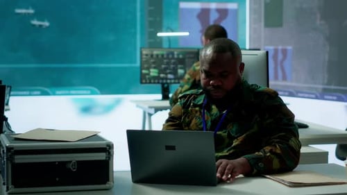 Men Work at Computers in Futuristic Office