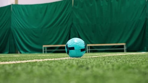 close-up of a soccer player's foot kicking the ball for a penalty or a goal or passing a ball