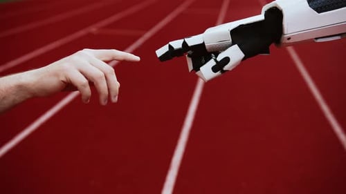 Closeup Shot of Unrecognizable Male Hand Touching Robot Finger on Blurred Background of Stadium
