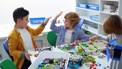 Robotics Programming Class Children Construct and Code Robot STEM Education Using Constructor Blocks