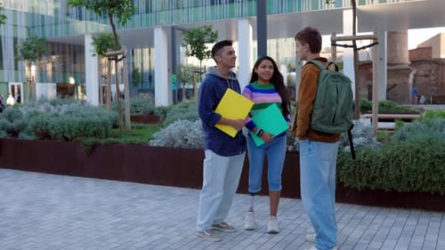 Three Diverse Student Friends Hanging Out While Standing at College Campus