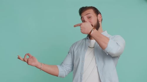 Lebanese Man Showing Thumbs Up Pointing Empty Place Advertising Area for Commercial Text Copy Space