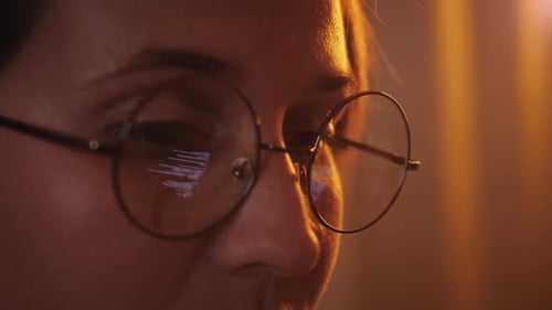Close Up View of Focused Business Woman Wears Glasses Looking at Pc Screen Reflection on Glasses