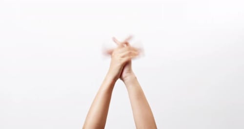 Close up of Woman's hand-clapping celebrating applause doing the hand gesture isolated on a white st