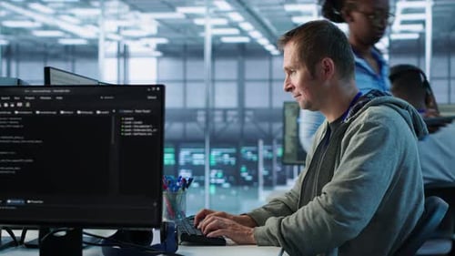 Man Working in Server Hub Capable of Processing Vast Amounts of Data