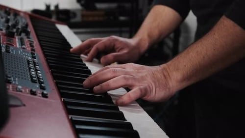 Close Up of Hands Playing Keyboard