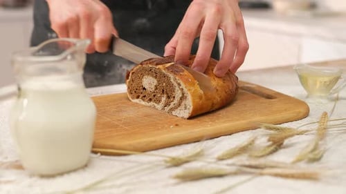 Cook Cutting Bread