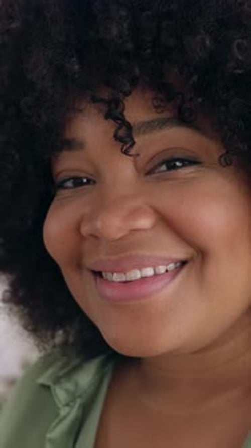 Portrait of Smiling Professional Woman Looking at Camera Standing in an Office