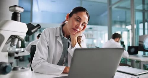 Tired Scientist Resting in Modern Lab