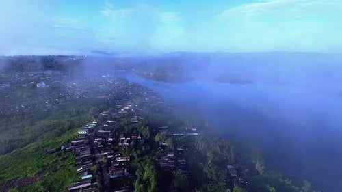 Aerial Shot of a Tropical Town Under Clouds