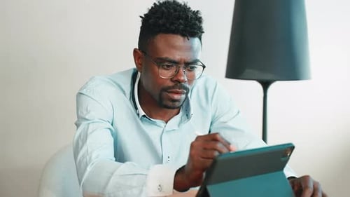 Man Architect Engineer Paints on Tablet