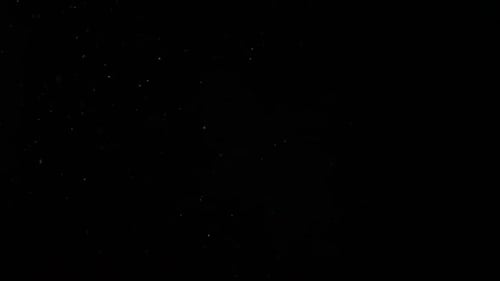 Abstract Particle Dust on Black Background
