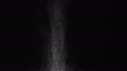 Explosion of White Powder on Black Background