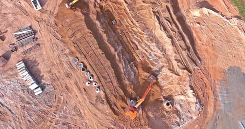 Construction Site with Earth Moving Equipment Aerial View