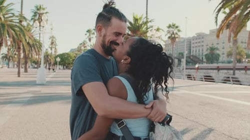 Romantic Couple Embracing in Tropical Urban Setting