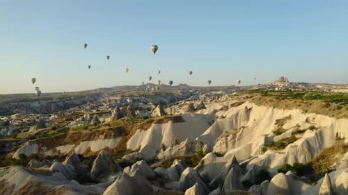 Cappadocia Turkey Hot Air Balloons rise over unique landscape