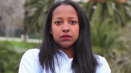 Young Woman Portrait Staring at Camera Outdoors