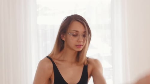 Young Blonde Woman Ballerina in the Studio