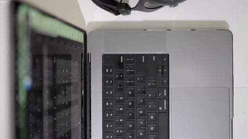 Laptop overhead headphones, smartphone for modern work environment concepts