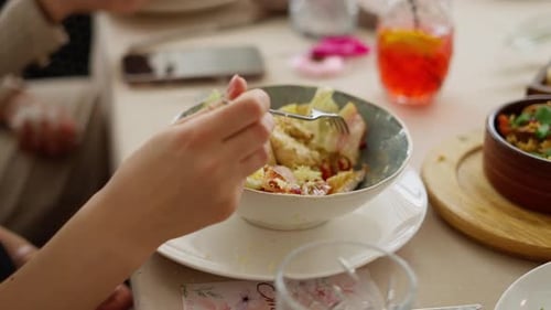 Having Salad for Lunch at a Dinner Table