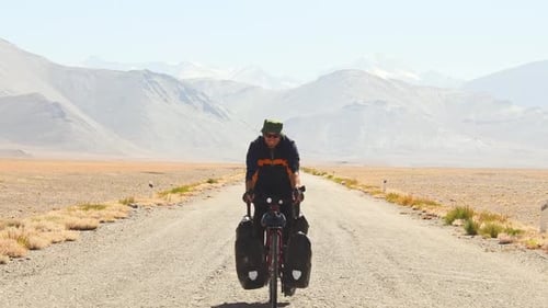 Bicycle Tourist On Pamir Higwhay Road