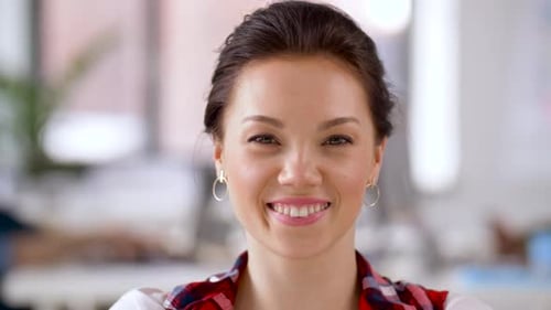 Smiling Young Woman Posing in Office Environment