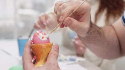 Closeup View of Traditional Process of Easter Eggs Coloring and Drawing