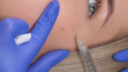 Cosmetic Injection Treatment on Woman's Face