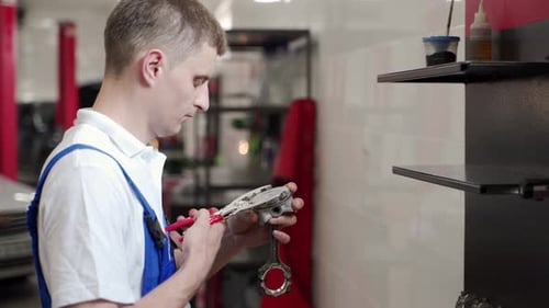 Auto Mechanic Assembles Engine Components in Workshop Precision Installation of Pistons Rings Into