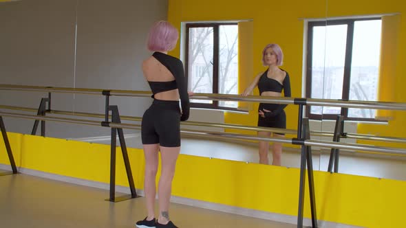Rear View of Graceful Woman Ballet Dancer Practicing Demi Plie Exercise ...