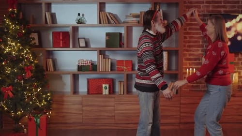 Senior Couple Dancing at Christmas in Cozy Home