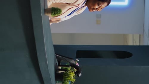 Employee Scanning Mobile Phone to Complete Purchase